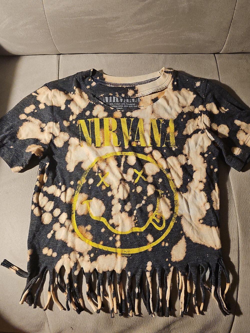 NIRVANA: Acid Wash Fringe Short Sleeve Graphic Tee